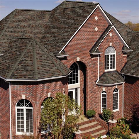 painted brick colors for house with brown metal roof|black shingles on brick house.